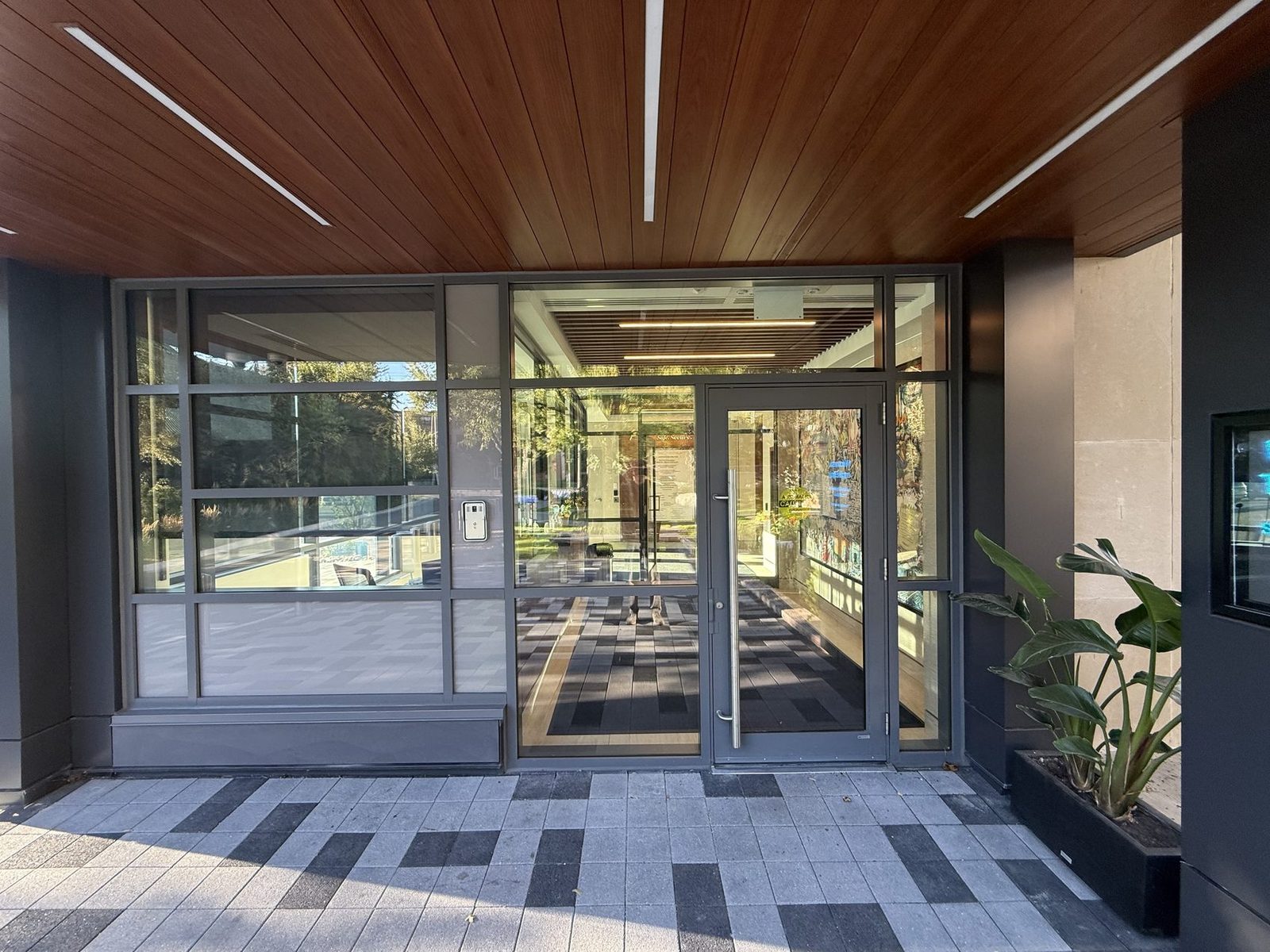 Glass-aluminum vestibule and entrance doors installed by Canuck Door Systems at Sonterlan Corporation, North York
